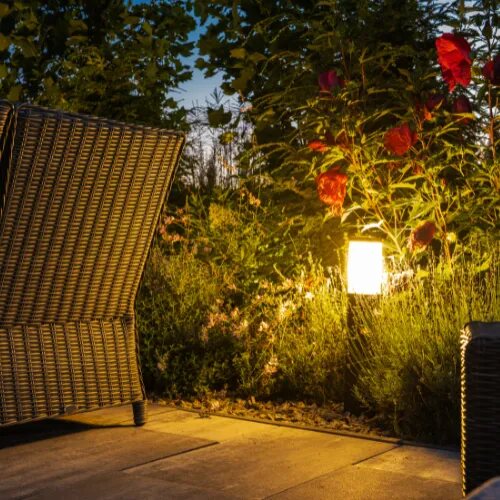 Patio lanterns glowing at dusk