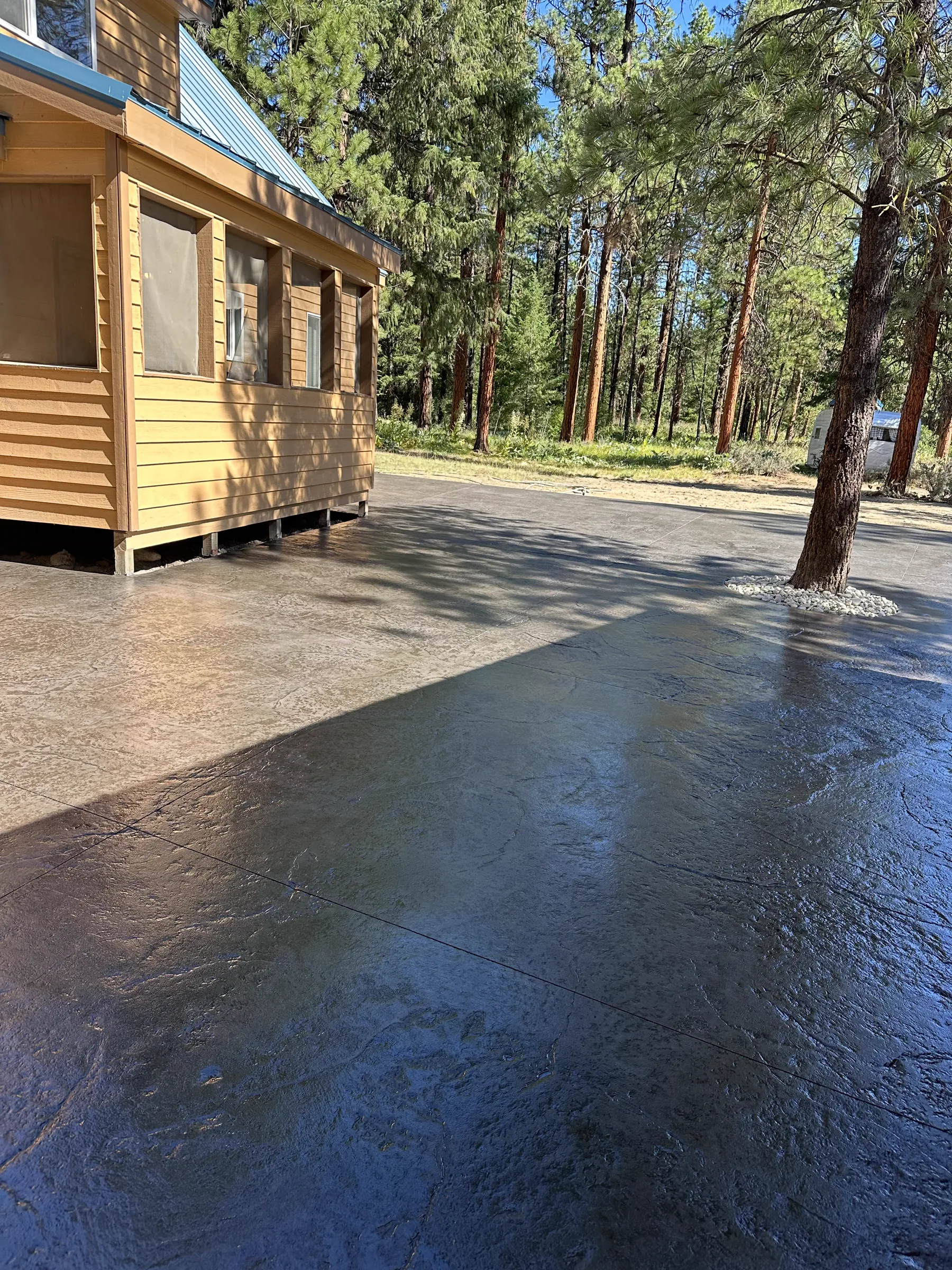 Stamped and sealed concrete patio at a mountain cabin