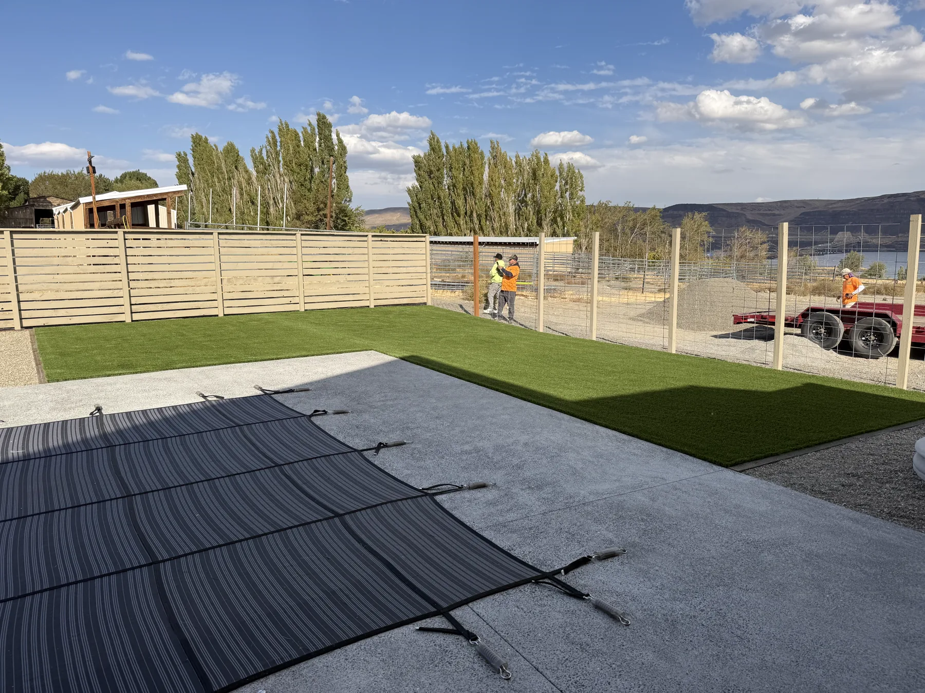 Artificial turf pool deck with lake views