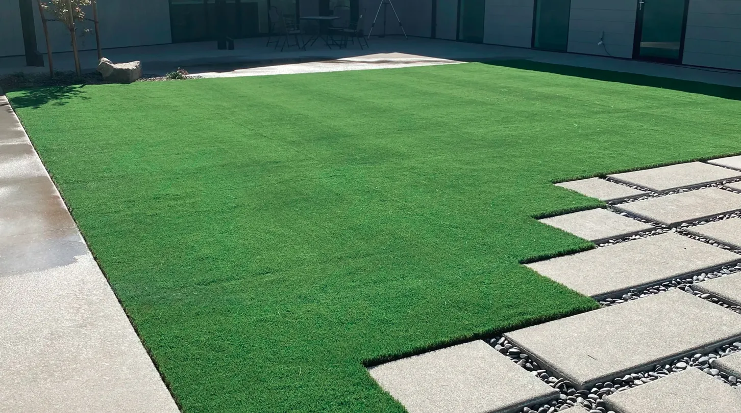 Artificial turf lawn with a paver walkway