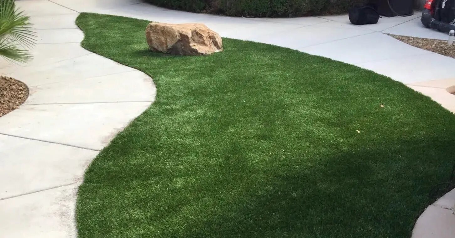 Curved walkway through artificial turf