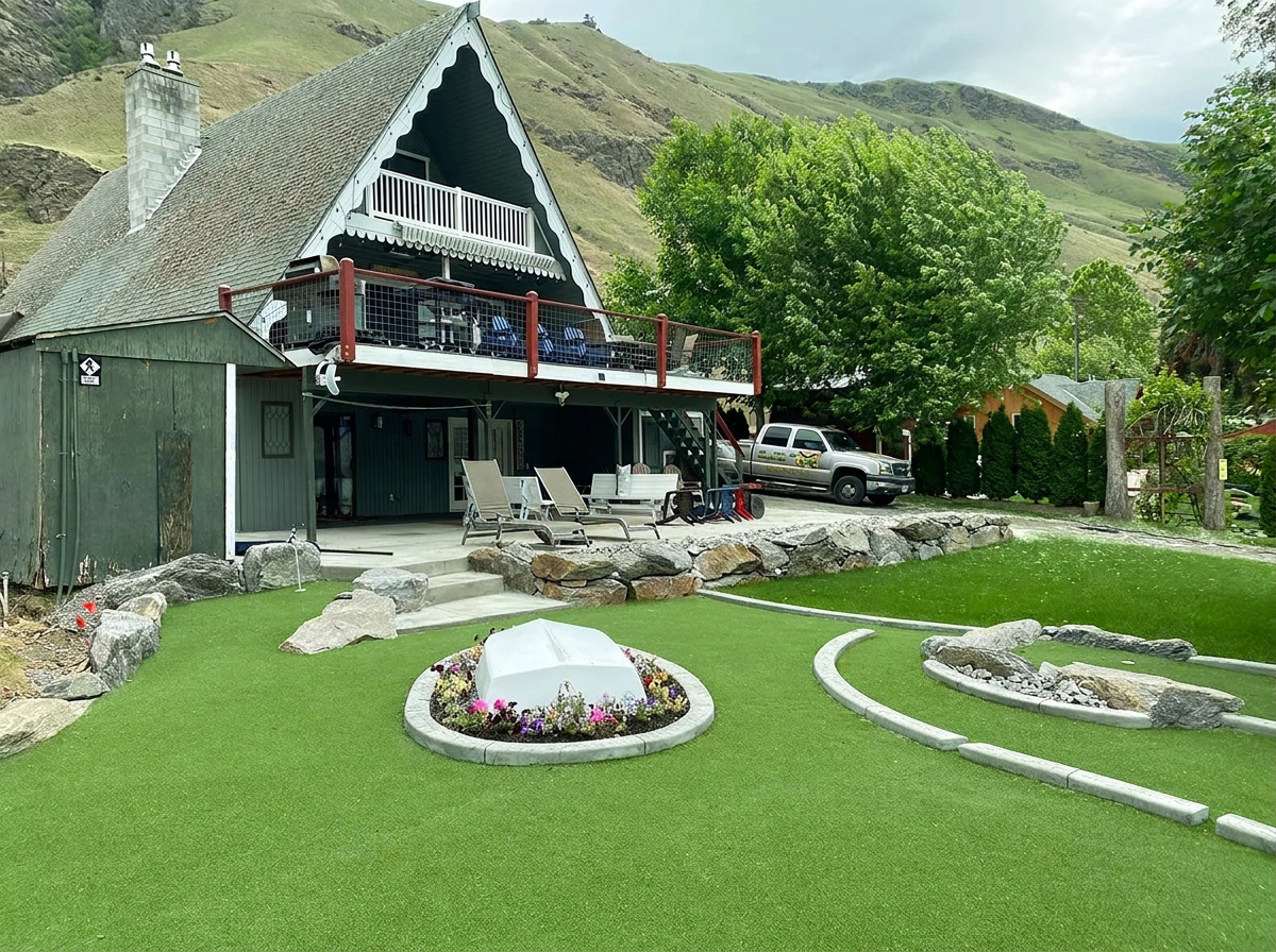 Artificial turf lawn beside an A-frame cabin