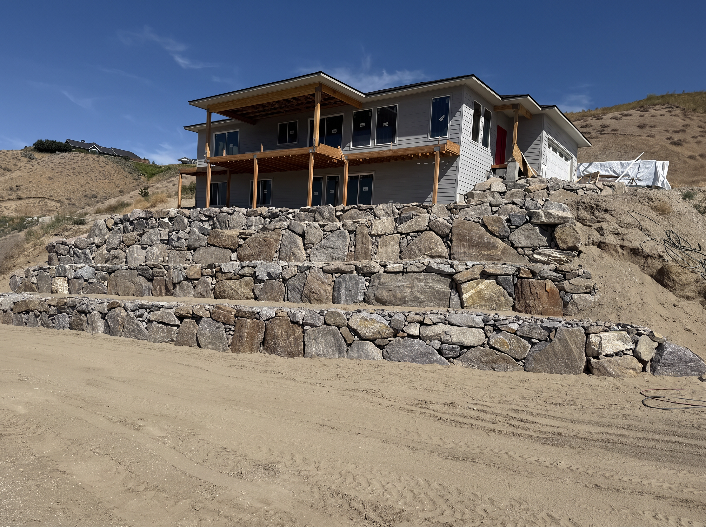 Full view of a tiered rock retaining wall in Central Washington